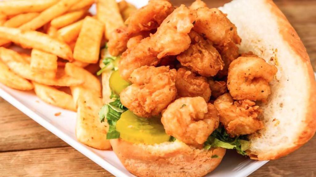 Shrimp Po Boy · Sandwich come dressed with lettuce, tomatoes, pickles, and mayonnaise on French bread. Served with seasoned fries.