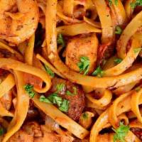 Jambalaya Pasta · Tender pasta tossed in a creamy alfredo roasted tomato sauce topped with grilled chicken bre...