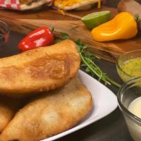 Jamón Y Queso Empanada · Grated white cheese and ham