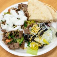 Gyro Shawarma Plate · Gyro cook with onions, green pepper, tabouli, tomatoes,  and the shawarma a  spicy on the gi...