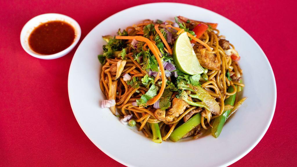 Chowmein · Dry noodles soaked in hot water and fried with mixed vegetables in frying pan.
