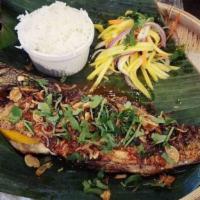 Crispy Fried Whole Fish With Tamarind Sauce · Gluten-free.  Fresh sea bass topped with crispy shallots,  fried garlic and cilantro side ma...