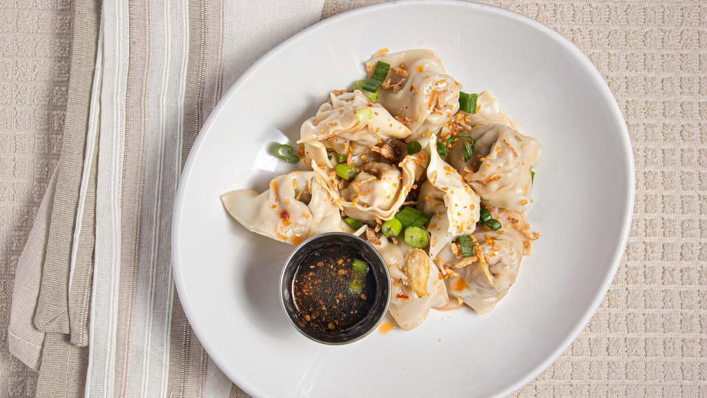 District 6 Wontons (8) · Spicy.  Steamed wontons filled with pork and shrimp topped with crispy shallots,  fried garlic,  green onions and drizzled with spicy chili sauce.