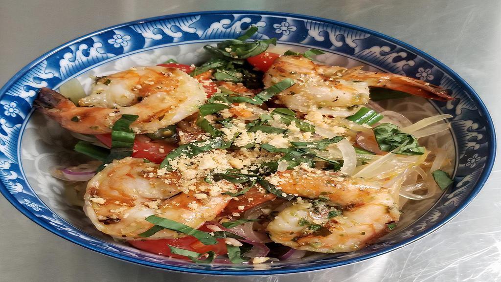 Papaya Salad With Grilled Shrimp · Spicy. Gluten-free.  Green papaya,  tomatoes , green bean,  red onions and basil topped with peanuts. Fried chicken can be substituted.