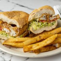 1/2 Po-Boy With Soup · Half of your choice of po-boy served with a cup of your choice  of soup.