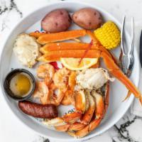Boiled Platter · A mix of Snow and Dungeness Crab with boiled shrimp, sausage, corn, and potatoes.