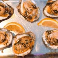 Chargrilled Oysters  · Cajun or Rosemary Garlic Sauces chargrilled on freshly shucked oyters on the half shell