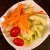 House Salad · Fresh lettuce, cucumber, tomato and ginger dressing.