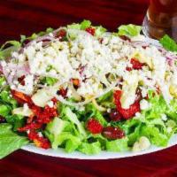 Mediterranean Salad · Fresh bibb lettuce topped with roasted garlic, onion, sun-dried tomato, artichoke hearts, ka...