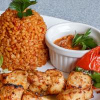 Chicken Shish · Grilled marinated chicken breast chunks served with rice and lavash bread.