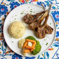 Lamb Chops · Char-grilled lamb chops served with rice and lavash bread.