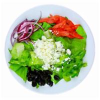 Greek Salad · Crumbled feta, black olives, tomatoes, red onions, green peppers tossed over crisp lettuce.