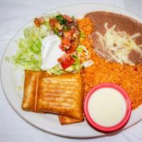 Chimichanga · Choice of chicken or beef. Served with lettuce, sour cream, guacamole, tomatoes, pico de gal...