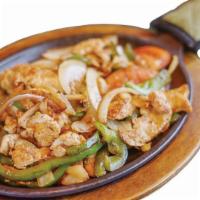 Fajitas · Chicken, beef or mixed sizzling steak strips with onions, bell peppers, and tomatoes. Served...