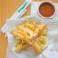 Shrimp Tempura · 4pcs Lightly battered fried Shrimp, 1pc zucchini,1pc sweet potato and 1pc onion ring.