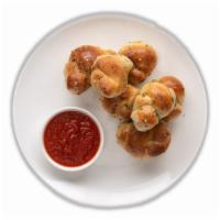 Garlic Knots (8) · Freshly Baked with savory blend of Fresh Garlic, Virgin Olive Oil, Oregano and Parsley finis...