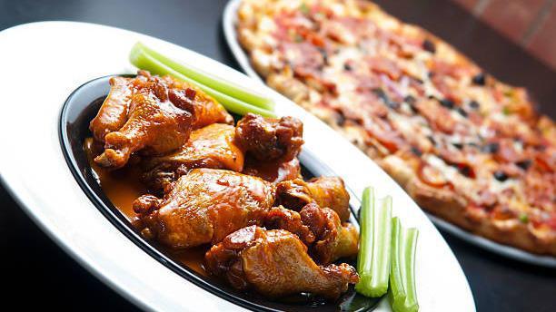 Small Buffalo Chicken Pizza And Wings · Pizza with grilled chicken and jalapeños dressed with mild Buffalo sauce. Comes with 6 wings of your flavor choice.