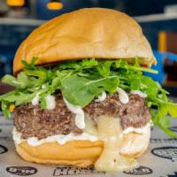 The Herman · Stuffed with Muenster cheese and topped with baby arugula and white truffle aioli