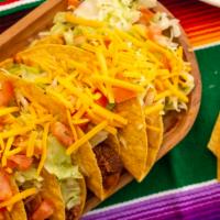 Tacos · Shredded chicken or ground beef.