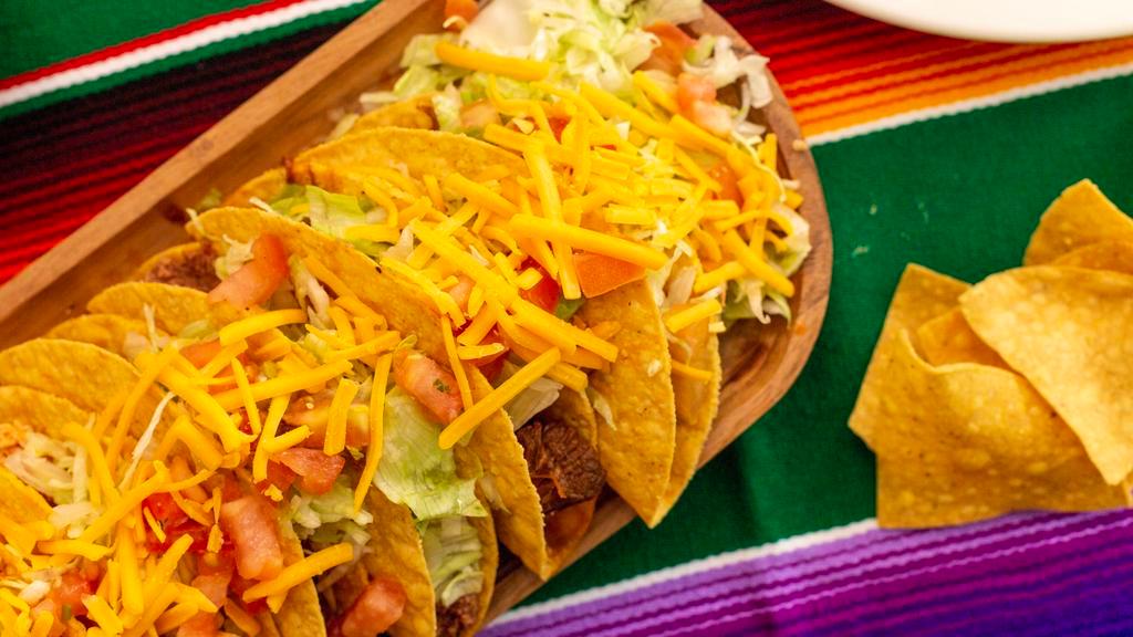 Tacos · Shredded chicken or ground beef.