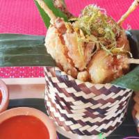 Red Curry Frog Legs · Deep fried frog legs marinated in red curry