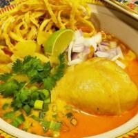 Khao Soi Chicken · Yellow curry noodle soup served with chicken drumstick