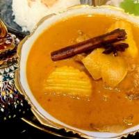 Massaman Ribeye · Ribeye stew in red curry sauce with Indian spices, potatoes, and peanuts