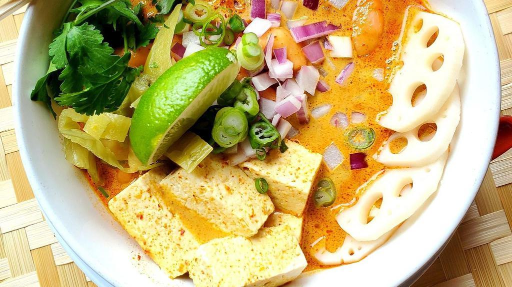 Khao Soi Tofu · Northern style yellow curry noodle soup with tofu, crispy soy protein and lotus root
