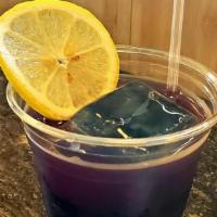 Purple Palmer · Lemongrass and butterfly pea flower tea, filled with butterfly pea tea ice cubes and freshly...