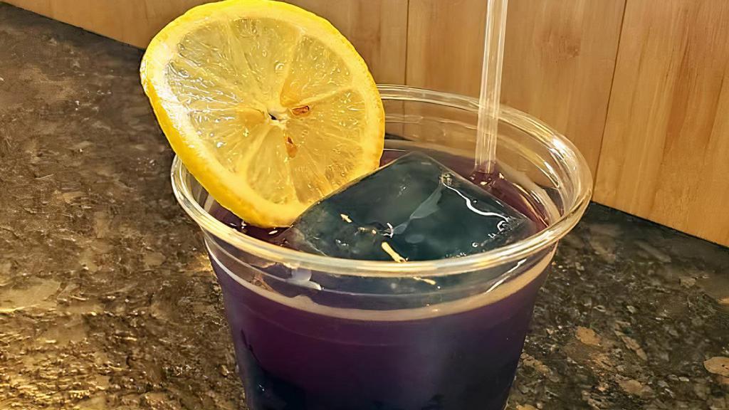 Purple Palmer · Lemongrass and butterfly pea flower tea, filled with butterfly pea tea ice cubes and freshly squeezed lemon juice