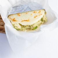 Arepa Reina Pepiada · Cooked Ground Maize Dough shaped into a thick disc, stuffed with Shredded Chicken Salad (Avo...