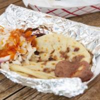 Pupusa Revuelta · Handmade Thick Corn Tortillas stuffed with Ground Pork, Cheese, and Refried Beans. Topped wi...