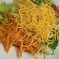 House Salad · Lettuce tomatoes cucumbers carrots and cheese with your choice of dressing.