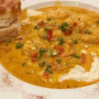 Shrimp & Grits · Our most popular dish consists of a delicious combination of our famous creamy grits with ei...