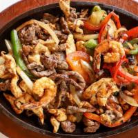 Fajita Mixta · grilled shrimp, steak, chicken, peppers, onion, served with rice, beans and salad