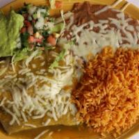 Enchiladas Mexicanas · Corn or flour tortilla filled with chicken, or steak, cooked in red sauce served with rice. ...