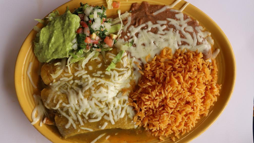 Enchiladas Mexicanas · Corn or flour tortilla filled with chicken, or steak, cooked in red sauce served with rice. Beans and salad.
