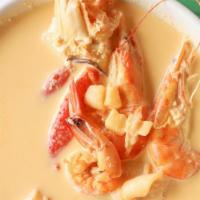Caldo Con Coco · shrimps, crab legs, fish, scallops, octopus, mussels, coconut milk, served with rice and beans