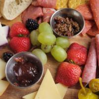 Charcuterie Board · Rotating selection of cheese and meats, pepperoncini, grapes, olive tapenade, seasonal jam, ...