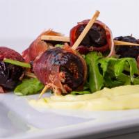 Figs & Proscuitto · Figs stuffed with manchego cheese and wrapped with proscuitto, served with a side of basil m...