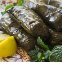 Grapes Leaves · Vine leaves stuffed with rice, tomato, parsley, mint and onion, cooked in lemon and olive oil.