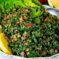 Tabbouleh · Chopped parsley, diced tomato, onion, mint, and crushed wheat (burghul) with fresh lemon jui...