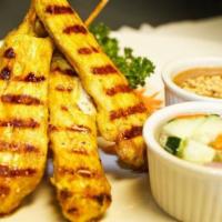 Grilled Chicken Satay (3) · Topped with peanut sauce and served with cucumber relish