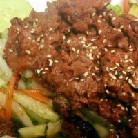 Grilled Beef Salad (Spicy Item) · Grilled beef steak with cucumber, onion, tomato and chili peppers tossed in a lime juice dre...