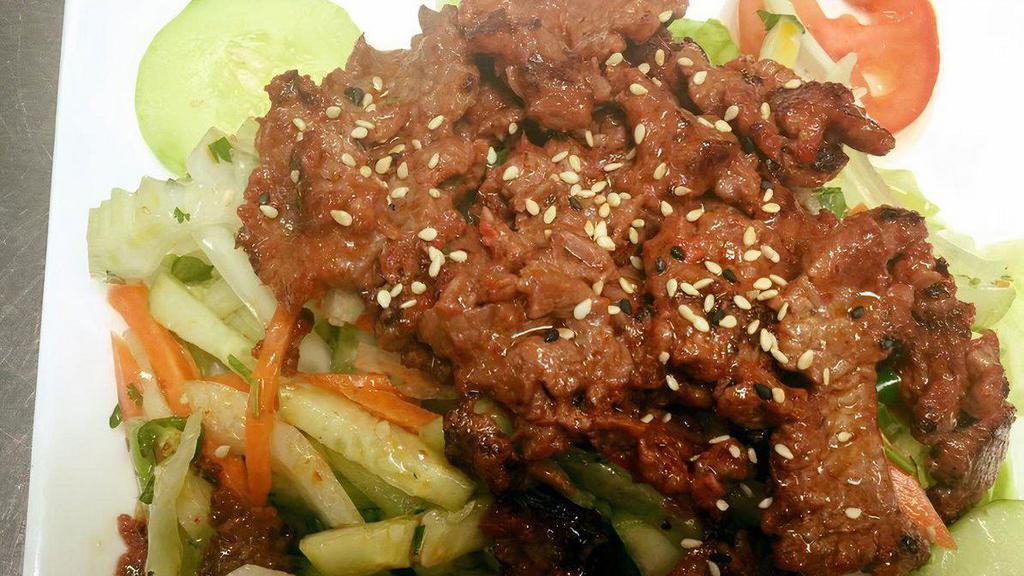 Grilled Beef Salad (Spicy Item) · Grilled beef steak with cucumber, onion, tomato and chili peppers tossed in a lime juice dressing.