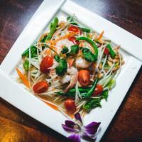 Green Papaya Salad · Hot and spicy. With roasted peanut and chili peppers dressed in lime juice and palm sugar