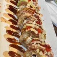 S-14. Super Volcano · Deep fried spicy crab, cream cheese, jalapeno, topped with spicy tuna, avocado and red tobik...