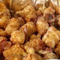 Loaded Tavern Tots · Loaded tots with beer cheese and bacon.