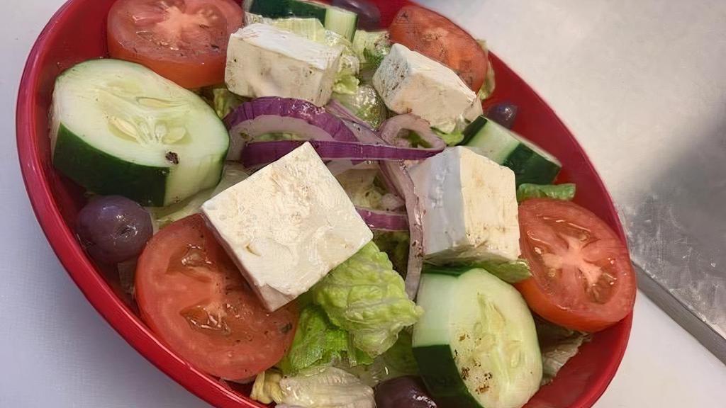 Greek Salad · Lettuce, Tomato, Onions, Cucumbers, Kalamata Olives & Feta Cheese  served with your choice of Dressing.