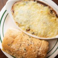 Spinach & Artichoke Dip · Creamy blend topped with melted Swiss cheese served with garlic bread.